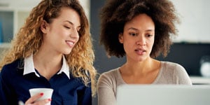 two women looking at paper_fotolia_148296875_M.jpg